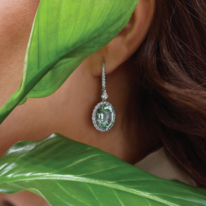 18ct white gold oval tourmaline and diamond drop earrings on the ear