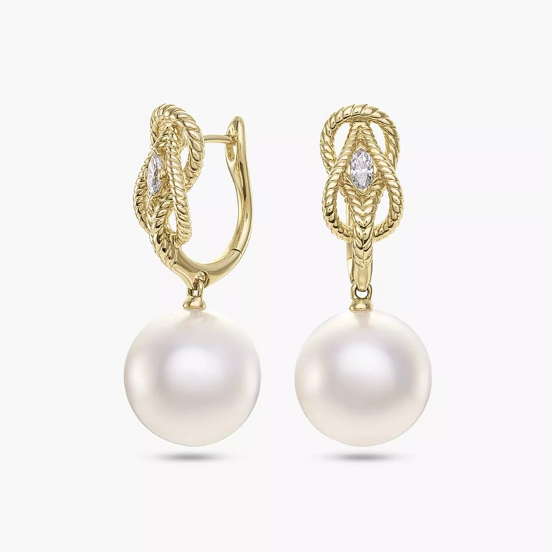 A pair of 18ct yellow gold earrings featuring South Sea Pearls and marquise diamond drops.