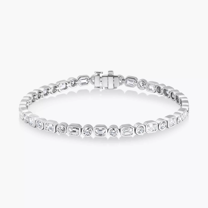 18ct white gold emerald and round brilliant cut diamond bezel set tennis bracelet