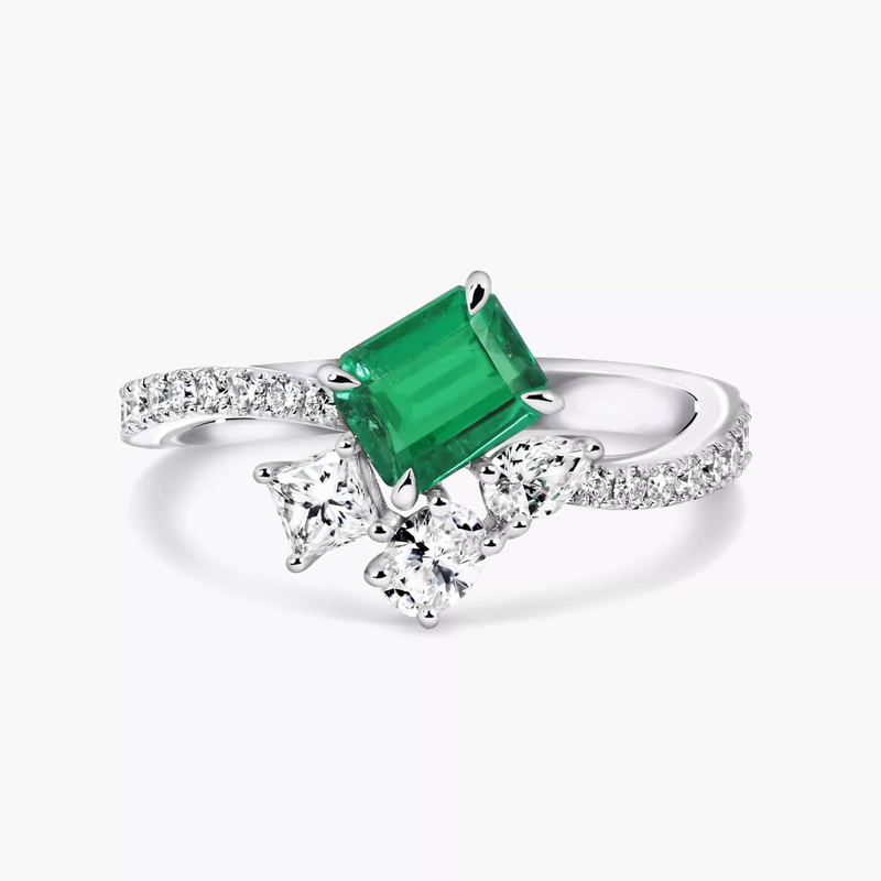 18ct white gold emerald cut Colombian emerald and diamond cluster ring