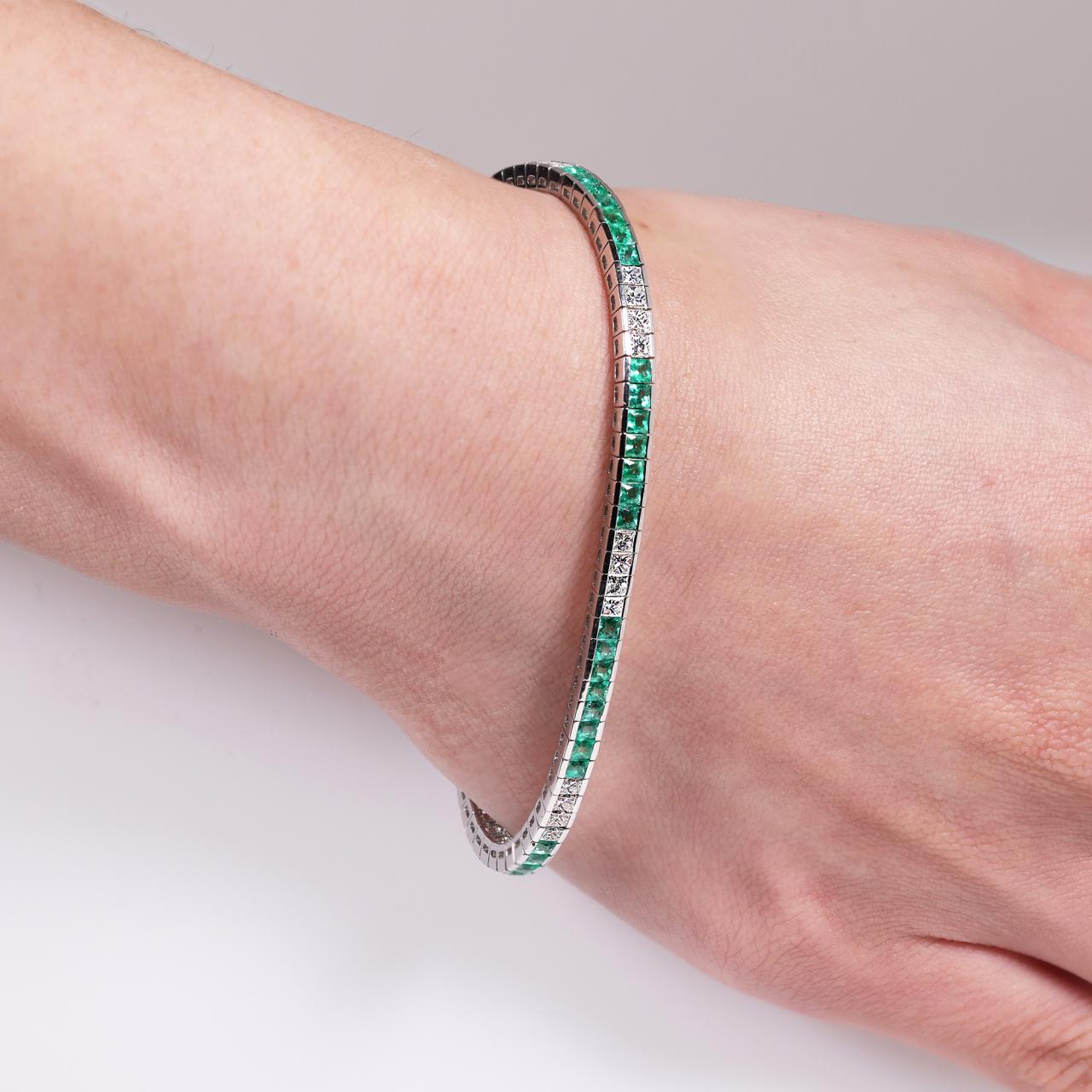 18ct white gold emerald and diamond bracelet on wrist