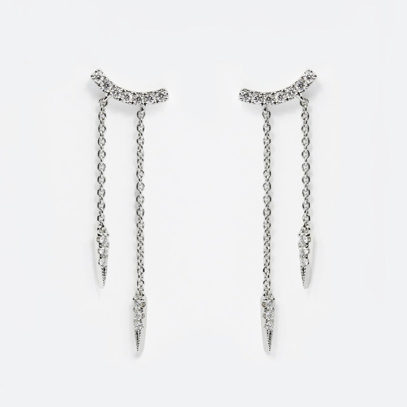 A pair of 18ct white gold diamond drop earrings with multiple chain drops and round brilliant cut diamonds.