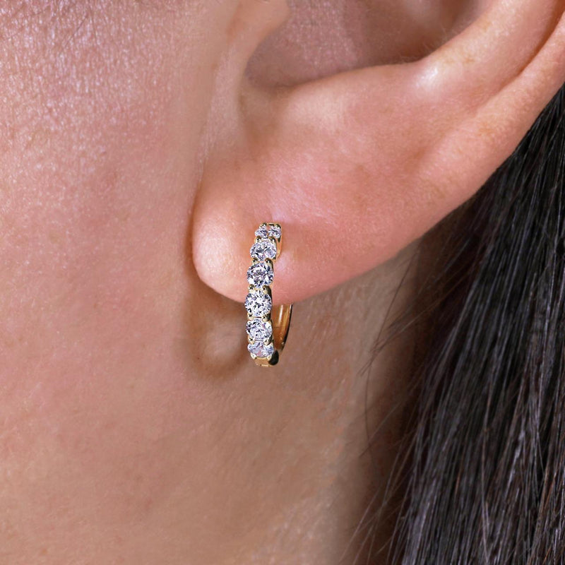 18ct yellow gold diamond claw set hoop earrings on the ear
