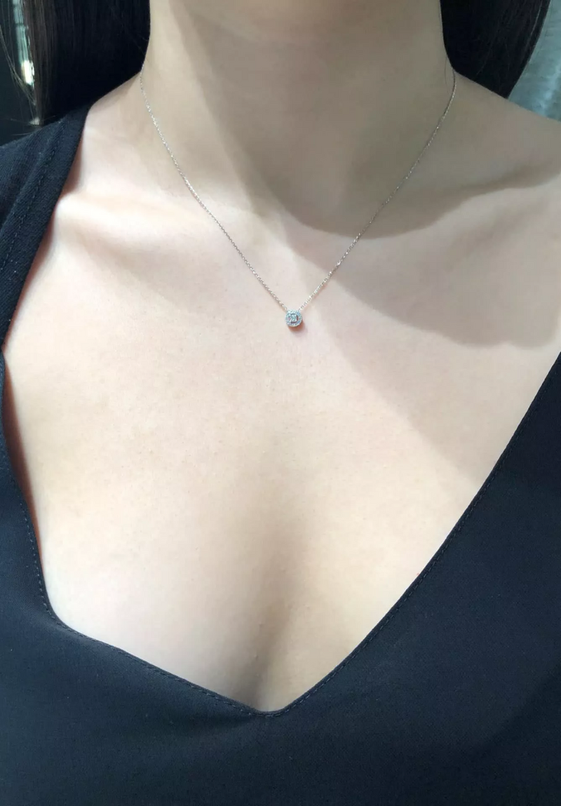 18ct white gold round cluster diamond halo necklace on the neck