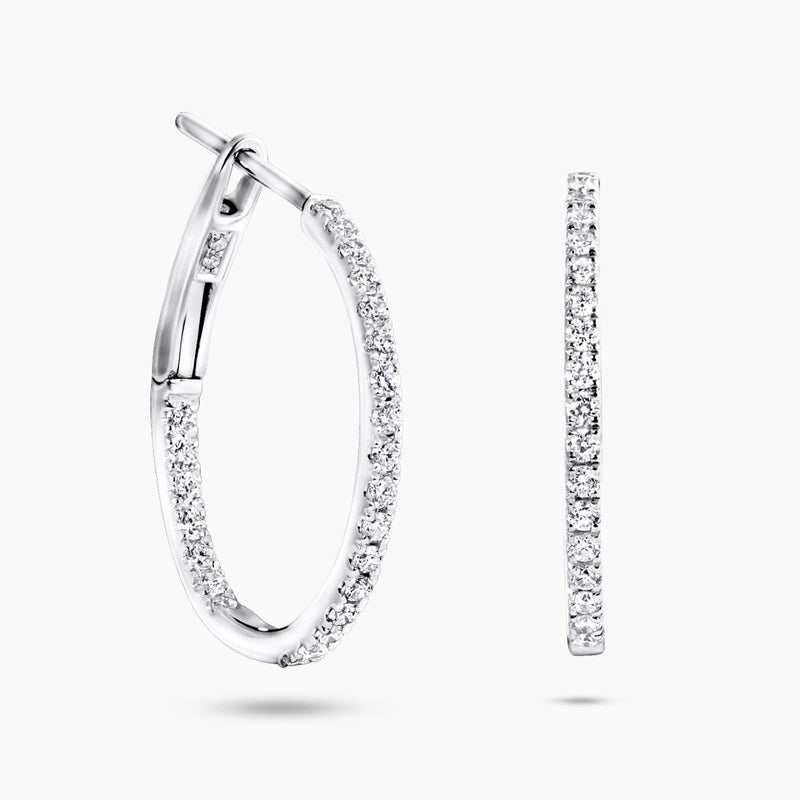A pair of 18ct white gold round diamond hoop earrings with multiple diamonds set around the hoop's perimeter.