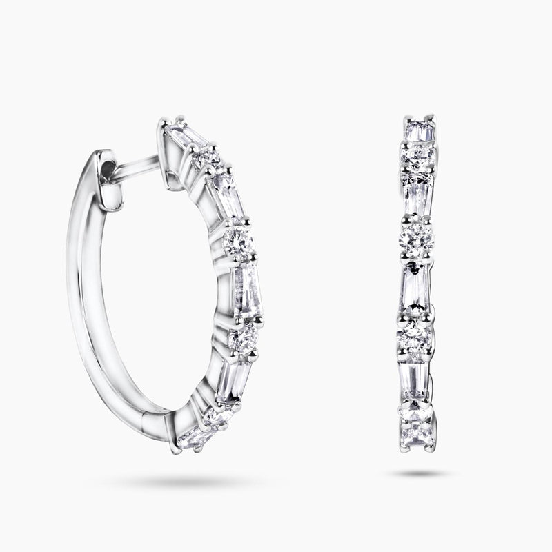 A pair of 18ct white gold diamond hoop earrings with round brilliant cut diamonds set in a hinged hoop design.