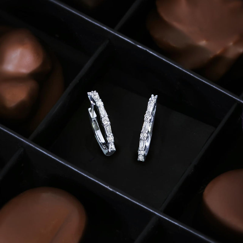 18ct white gold diamond hinged hoop earrings photographed with chocolate