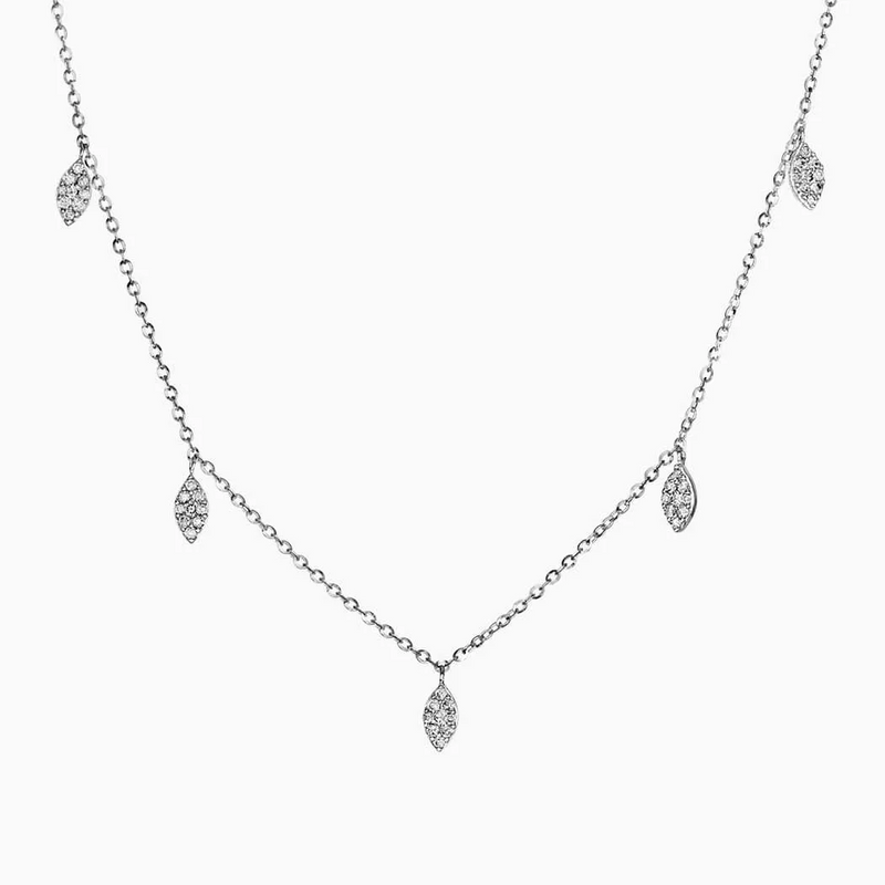 An 18ct white gold necklace with leaf-shaped diamond pendants.