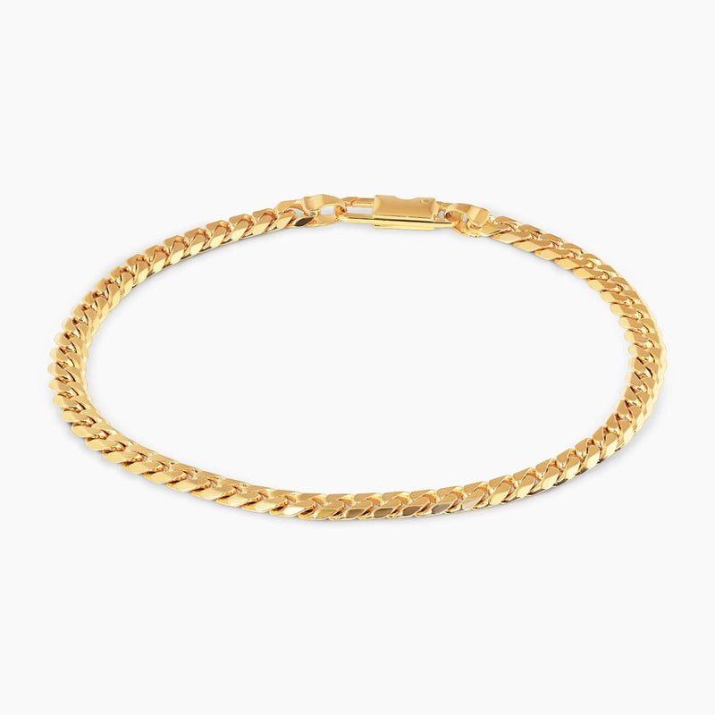 18ct yellow gold 21cm flat curb link bracelet with parrot clasp