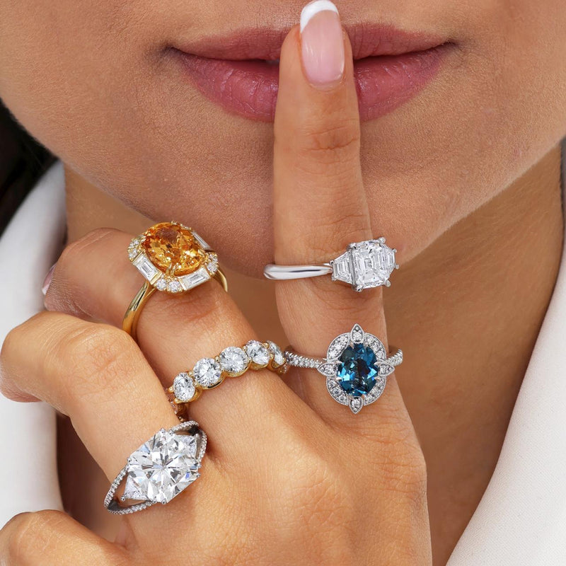 18ct yellow gold oval yellow topaz and diamond ring on the fingert