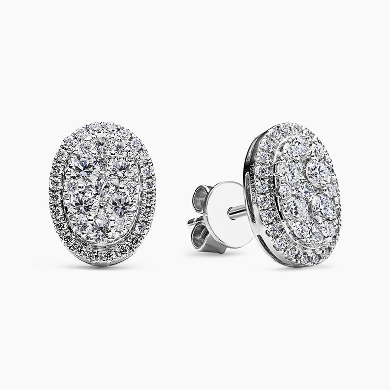 A pair of 18ct white gold diamond cluster oval shape stud earrings.