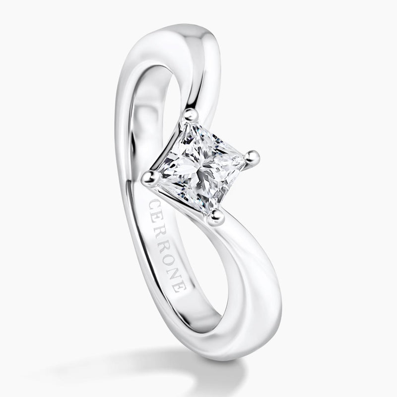 18ct white gold Princess cut diamond solitaire engagement ring in a four claw setting on the side