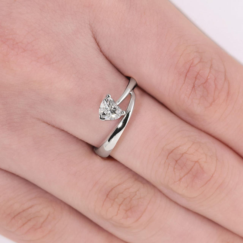 18ct white gold heart shaped diamond twist ring on the finger