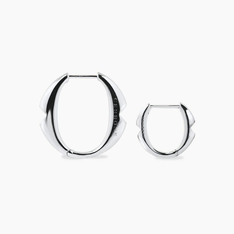 A pair of 18ct white gold small 'O' hoop earrings from the Iconica Collection beside the large size hoop to compare size