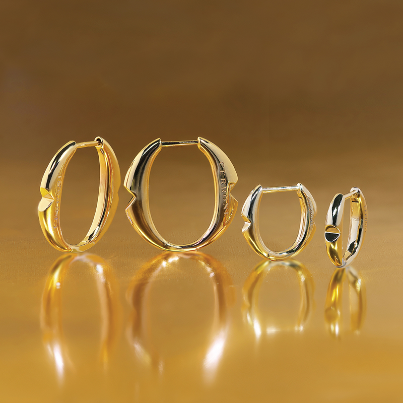 18ct yellow gold large ‘O’ hoop earrings from the Iconica Collection beside small size hoop to compare size