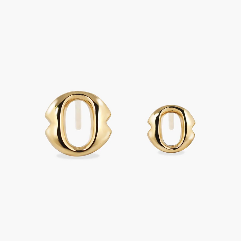 A pair of 18ct yellow gold small 'O' stud earrings from the Iconica Collection beside the smaller size to compare sizing