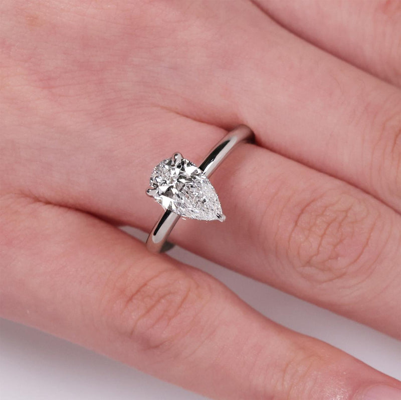 18ct white gold 1.51ct pear shaped diamond hidden halo ring on finger