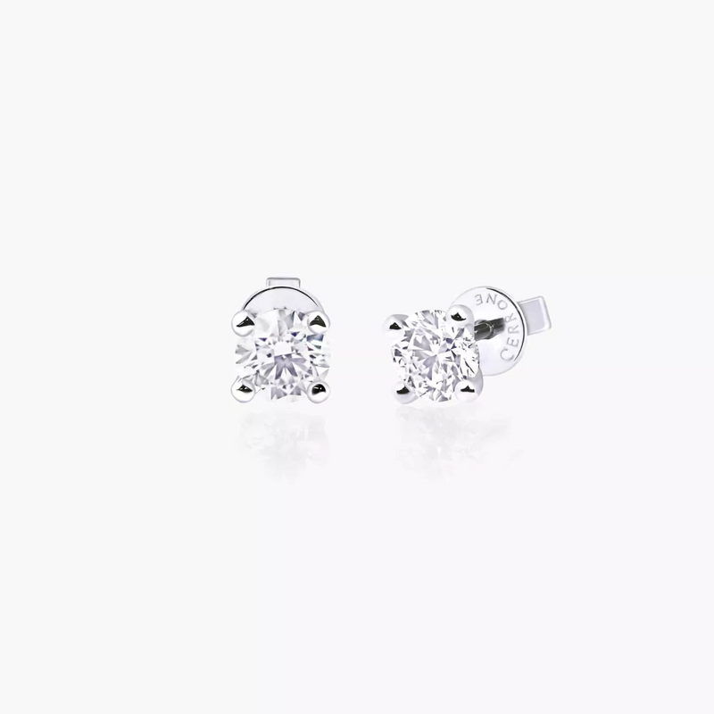 A pair of 18ct white gold round brilliant cut diamond stud earrings with a four claw setting.