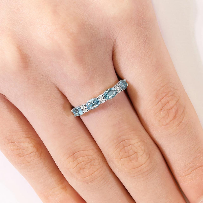 18ct white gold oval aquamarine and round diamond ring on the finger