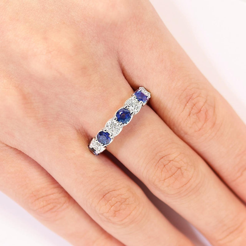 18ct white gold round sapphire and diamond ring on the finger