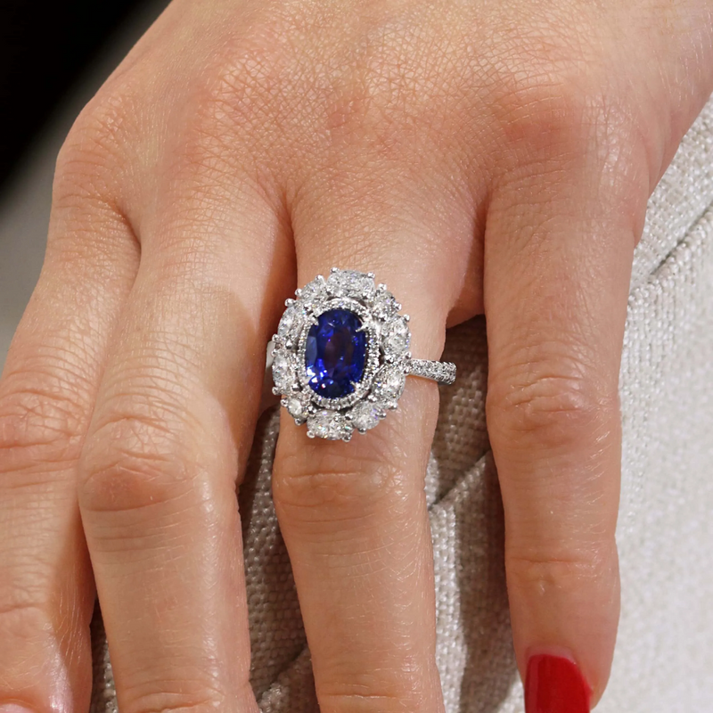 18ct white gold oval Ceylon sapphire and diamond ring on the finger