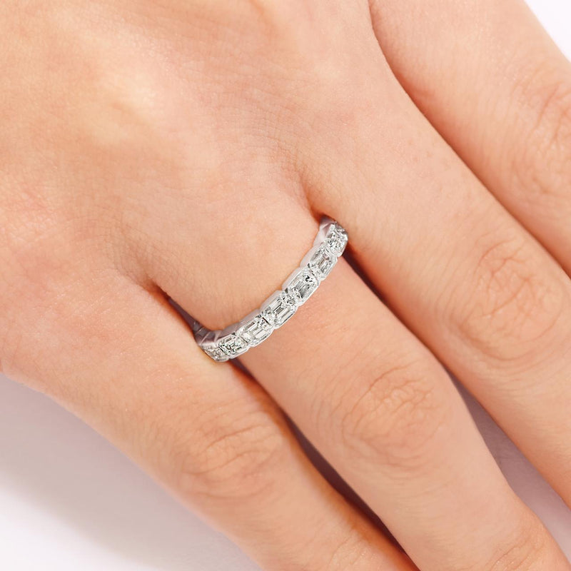18ct white gold bezel set emerald cut diamond full circle ring on the finger