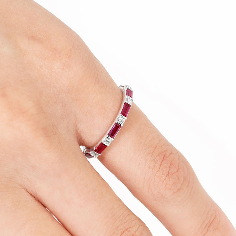 18ct white gold baguette cut ruby and princess cut diamond ring on the finger