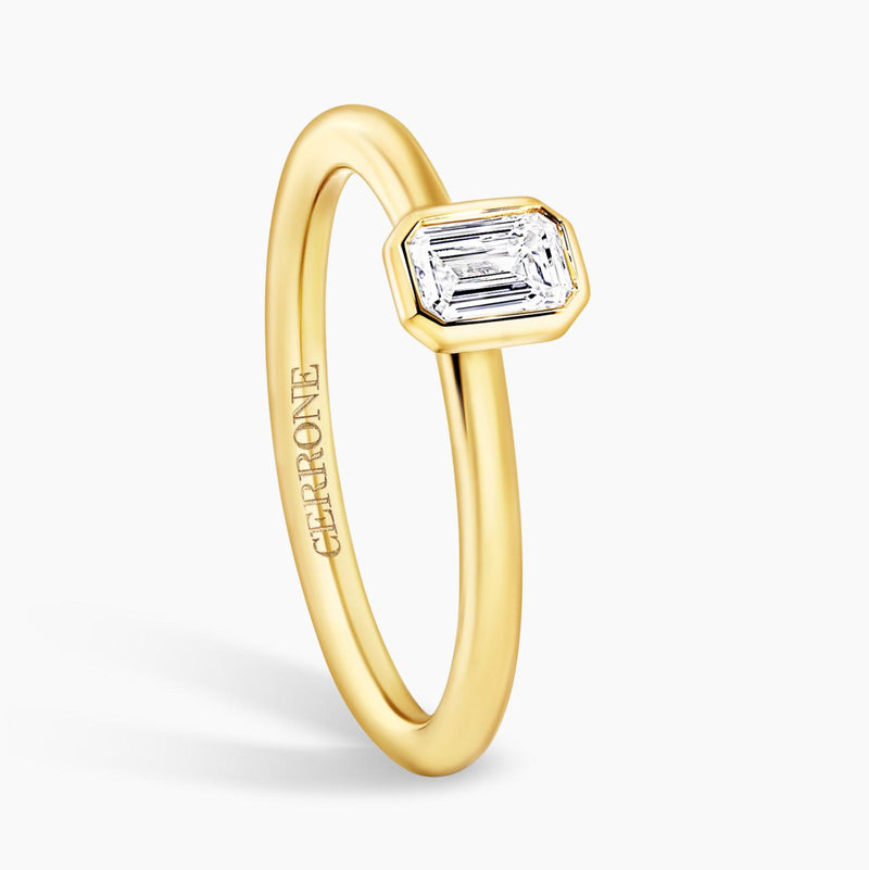 18ct yellow gold emerald cut bezel set diamond solitaire engagement ring side profile