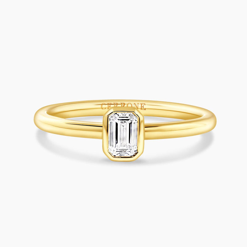 18ct yellow gold emerald cut bezel set diamond solitaire engagement ring