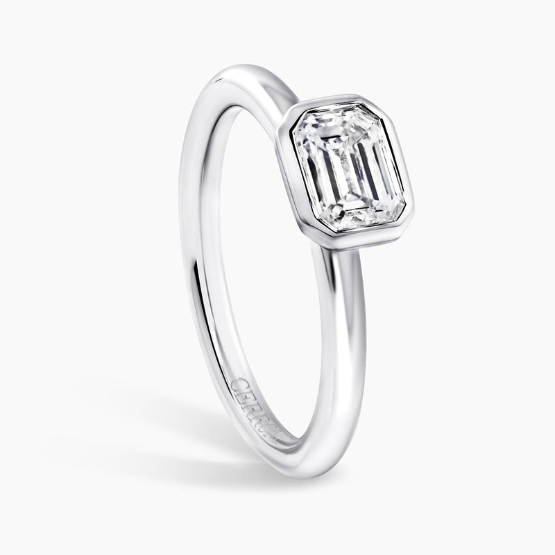 18ct white gold emerald cut bezel set diamond solitaire engagement ring side view