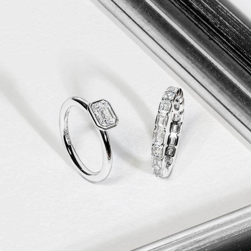 18ct white gold emerald cut bezel set diamond solitaire engagement ring with wedding ring