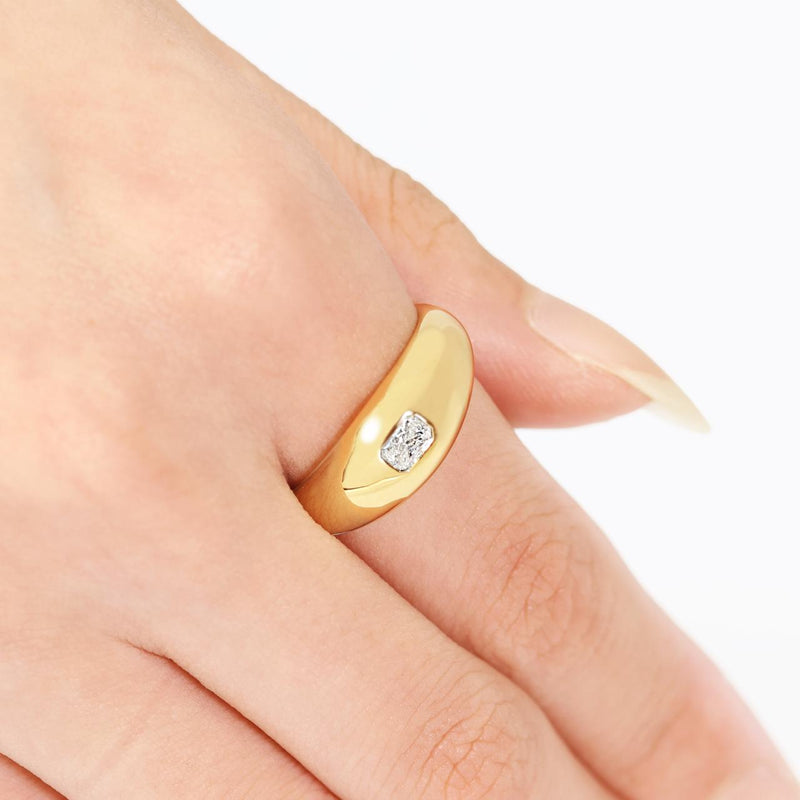 18ct yellow gold radiant cut diamond bezel set ring on the finger