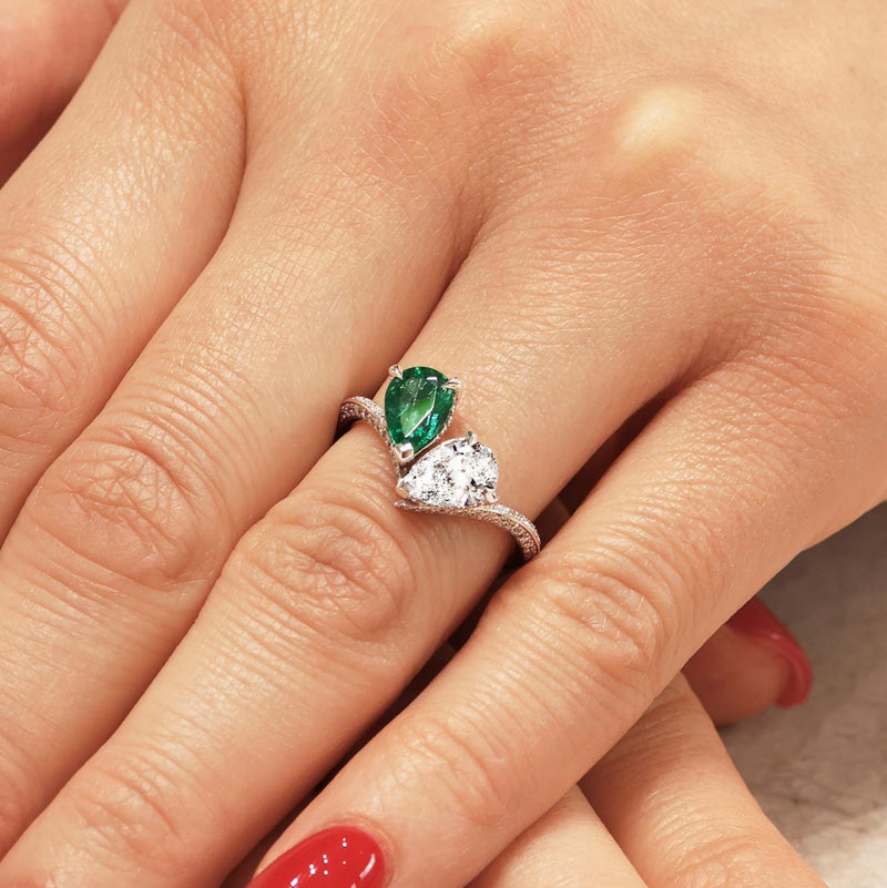 18ct white gold pear shape Zambian emerald and diamond ring on the finger
