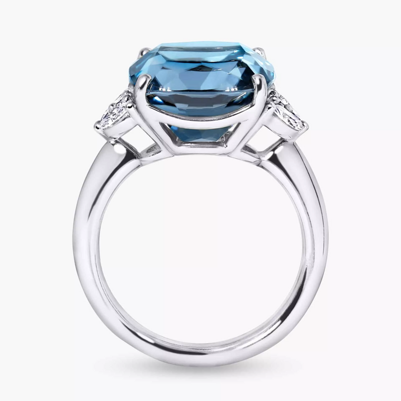 18ct white gold cushion cut Swiss blue topaz, marquise and round brilliant cut diamond ring side setting