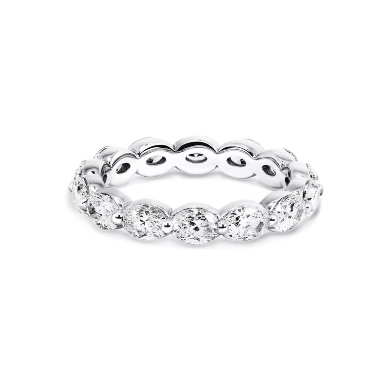 An 18ct white gold oval brilliant cut full circle diamond band with claw settings.