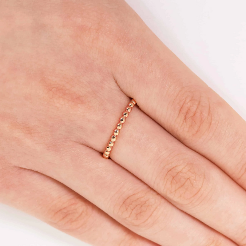 18ct rose gold full circle ball ring on the finger