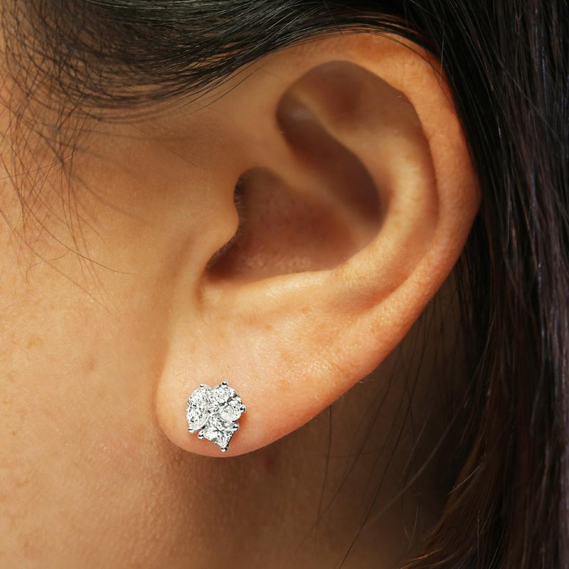 18ct white gold marquise, princess, oval cut diamonds stud earrings on the ear