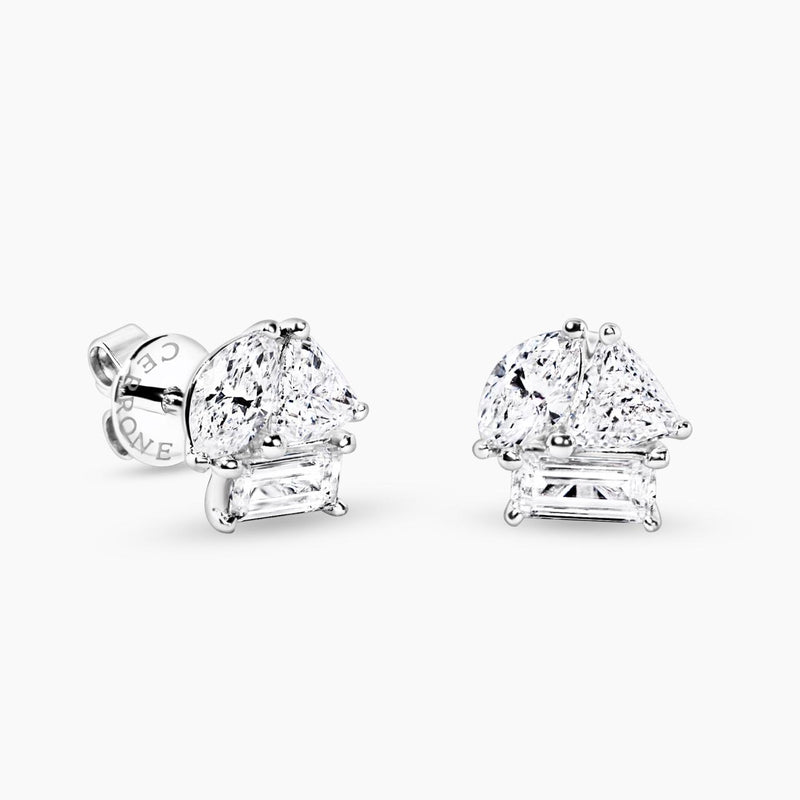 A pair of 18ct white gold diamond stud earrings featuring trillion, baguette, and marquise cut diamonds in a claw setting.