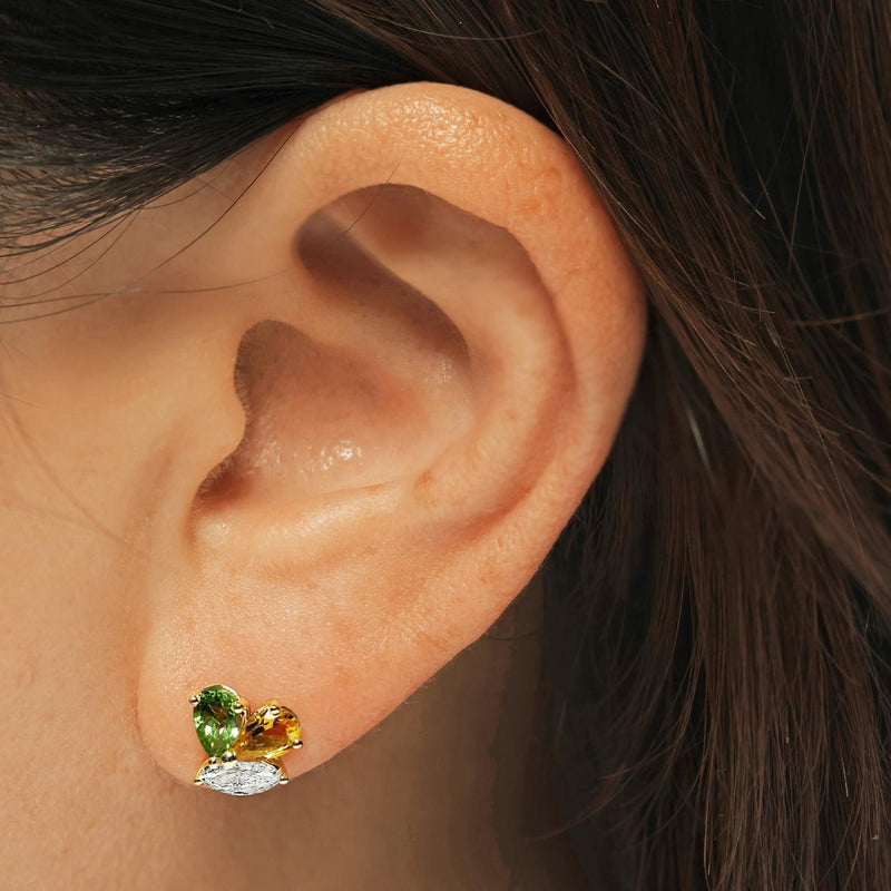 18ct yellow gold marquise diamonds and pear shaped yellow and green topaz stud earrings on the ear
