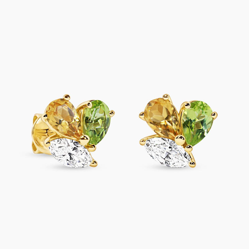 A pair of 18ct yellow gold stud earrings featuring marquise diamonds and pear-shaped yellow and green topaz in a claw setting.
