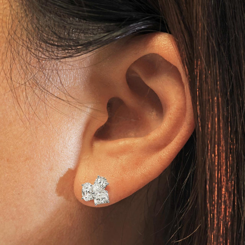 18ct white gold pear, oval radiant diamond stud earrings on the ear