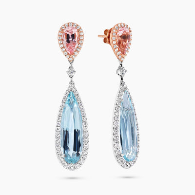 A pair of 18ct white and rose gold drop earrings featuring aquamarine and morganite gemstones with a halo of round brilliant cut diamonds.