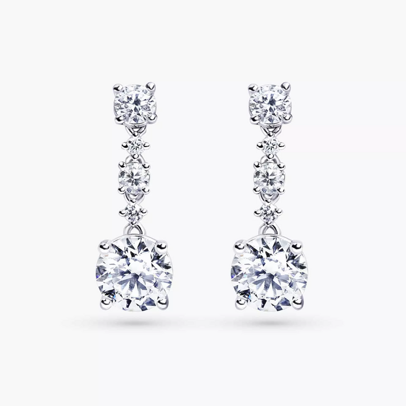 A pair of 18ct white gold diamond drop earrings with round brilliant cut diamonds in a four claw setting