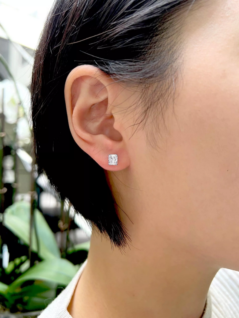 18ct white gold Radiant cut diamond stud earrings on the ear