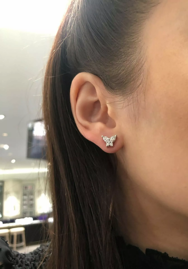 18ct white gold diamond butterfly stud earrings on the ear
