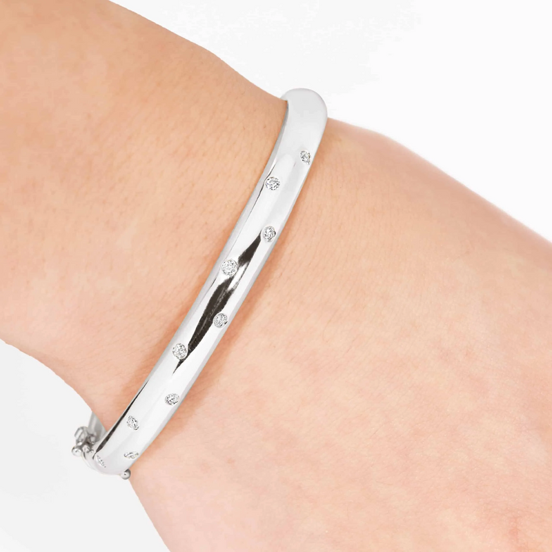 18ct white gold drop set diamond bangle on the wrist