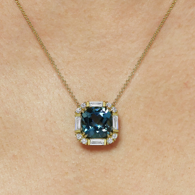 18ct yellow gold cushion cut london blue topaz and diamond necklace on the neck