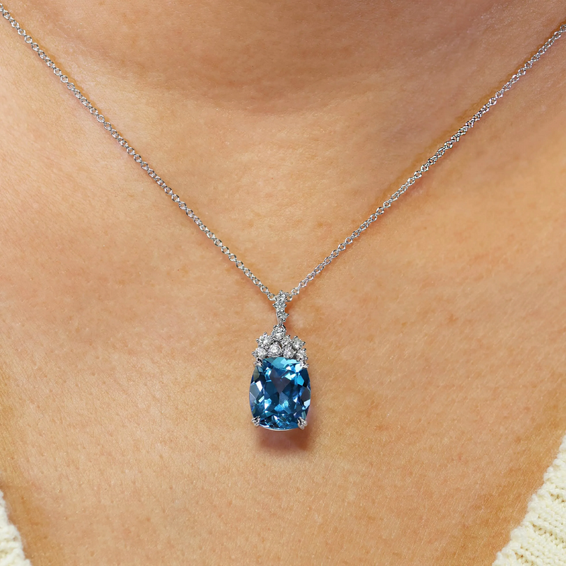 18ct white gold cushion cut Swiss Blue topaz and diamond necklace on the neck