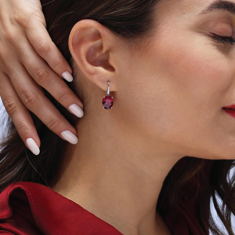 18ct rose and white gold oval rhodolite garnet and diamond hook earrings on the ear
