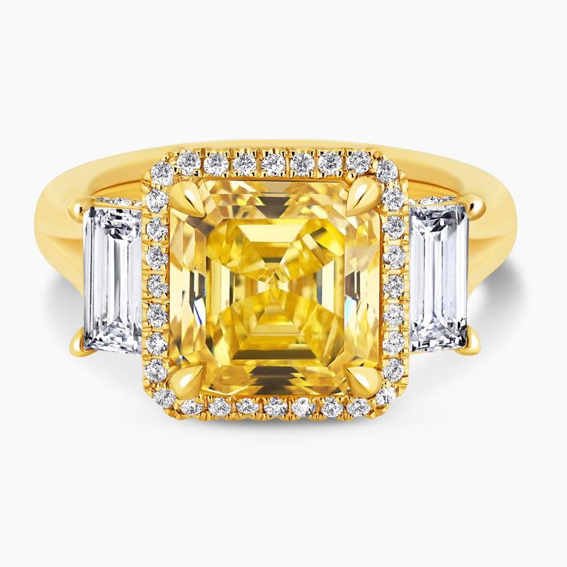 18ct yellow gold Fancy Vivid Yellow asscher cut diamond ring with baguette and round brilliant cut diamonds
